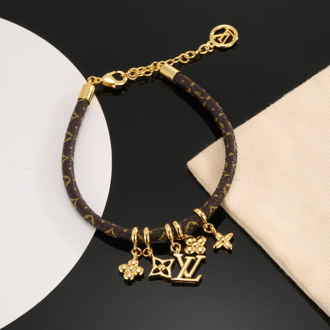 Louis Vuitton Monogram Leather Bracelet with Gold Charms